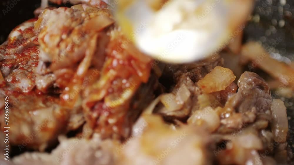 Chicken or pork stew with red and green pepper onion, and spices cooking in a frying pan. Traditional mexican cuisine, tacos preparation, ragout. Chicken or pork stew with red and green pepper onion, and spices cooking in a frying pan. Traditional mexican cuisine, tacos preparation, ragout.