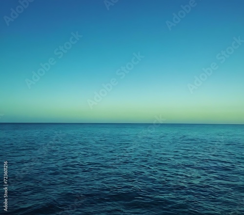 Calm oceanic gradient from deep blue to seafoam green