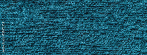 Texture of dark turquoise color background from textile material with pattern, macro.