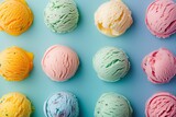 Assorted colorful ice cream scoops on blue background.
