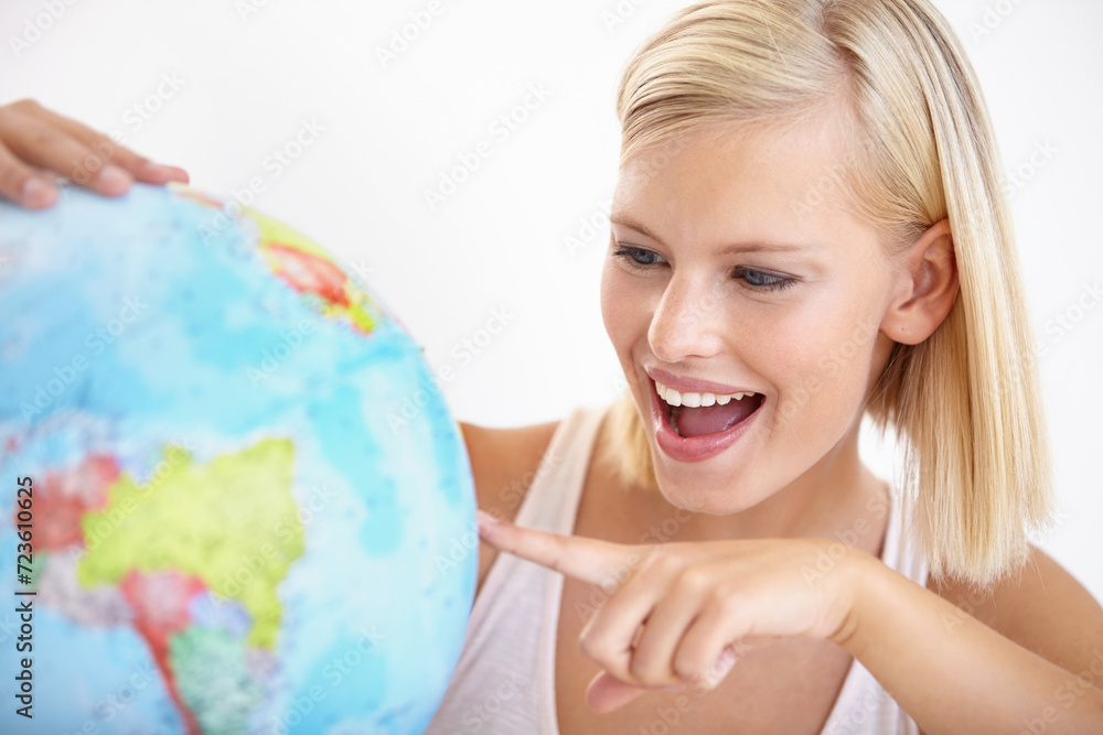 Woman, travel and globe with point and happy from earth day, holiday or international vacation. Smile, world and map for learning and geography with a female person and destination on the planet Woman, travel and globe with point and happy from earth day, holiday or international vacation. Smile, world and map for learning and geography with a female person and destination on the planet