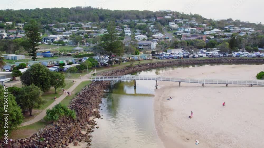 Aerial view over bridge and caravan park at Crescent Head, NSW during peak season Aerial view over bridge and caravan park at Crescent Head, NSW during peak season