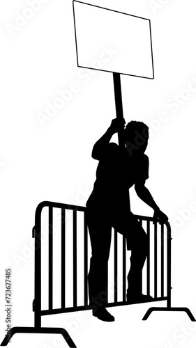 Protestor or demonstrator at a demonstration march, picket line or strike protest rally in silhouette. Holding up a banner or picket sign board placard.