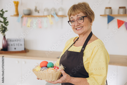 Photography Happy Easter! Cute retired old woman painted easter egg
