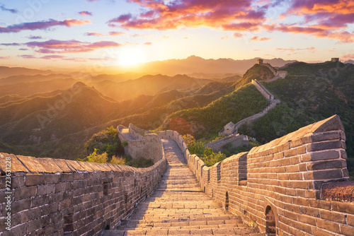 Golden afternoon sunlight on the Great Wall of China at the Jinshanling section near Beijing. Empty Great wall of China under sunshine during sunset, Jinshanling, Hebei, Beijing, China photo
