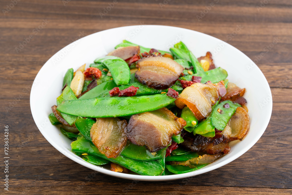 A plate of fried peas and bacon