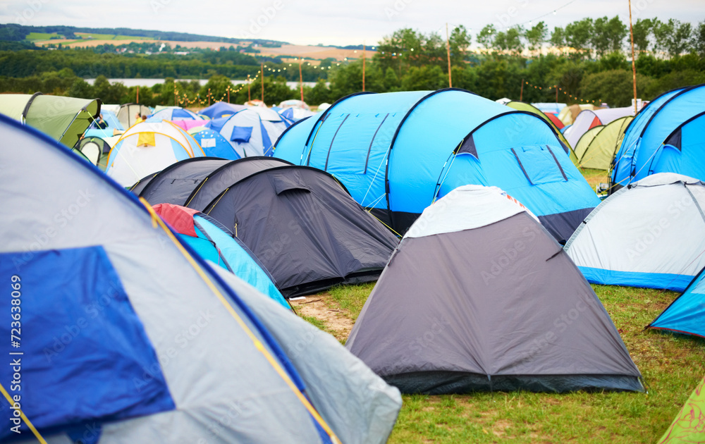 Tents, field and music festival outdoor for camp event in forest for party celebration, rave weekend on vacation. Shelter, land for crowd concert or dj disco accommodation, park trip in woods nature