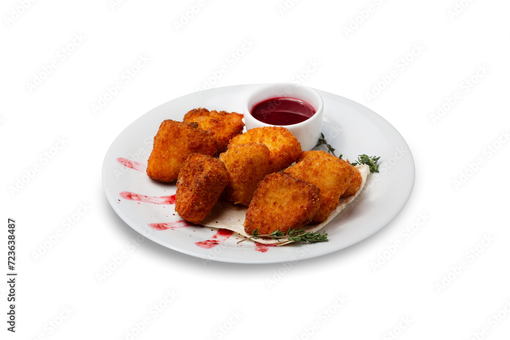 Fried cheese in breadcrumbs with sauce on a plate, isolated Fried cheese in breadcrumbs with sauce on a plate, isolated