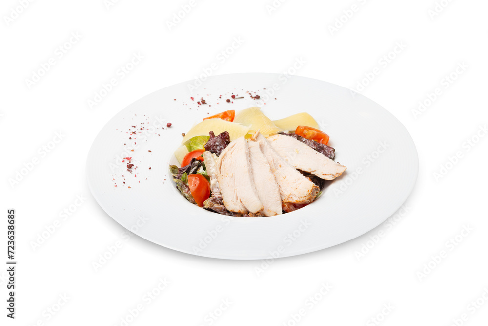Caesar salad with chicken on a plate, isolated Caesar salad with chicken on a plate, isolated