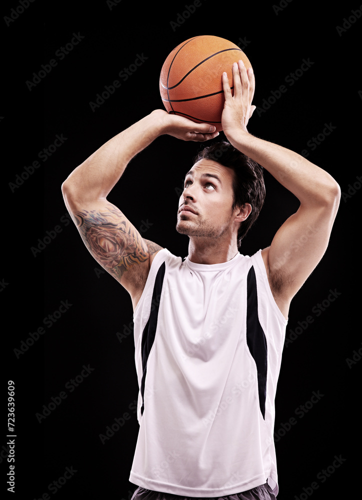 Basketball, shooting and man in studio with fitness, training or game target practice on black background. Sports, exercise or male player with handball for body workout, performance or aim challenge