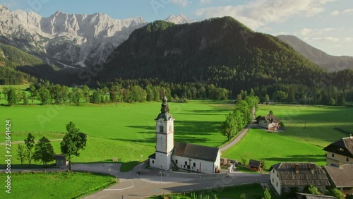 Idyllic Alpine landscape with a church in Zgornje Jezersko, Slovenia photo
