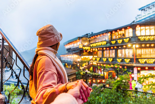 Young couple tourist traveling at Jiufen old street landmark and popular attractions in Taiwan photo