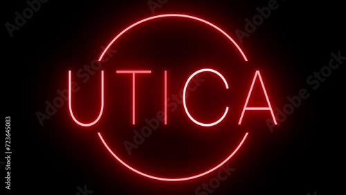 Flickering red retro style neon sign glowing against a black background for UTICA
