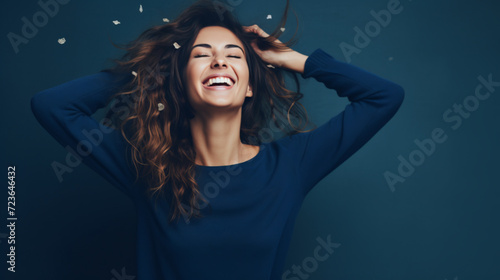 Portrait of an excited young woman celebrating success