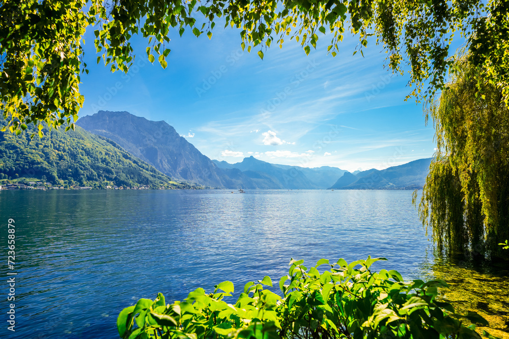 View of Traunsee and the surrounding landscape. Idyllic nature by the lake in Styria in Austria. Mountain lake at the Dead Mountains in the Salzkammergut.
 - obrazy, fototapety, plakaty 