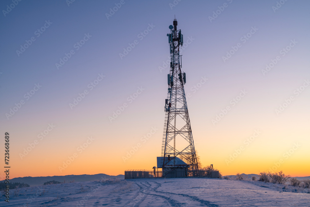 telecommunications tower in a winter mountainous setting telecommunications tower in a winter mountainous setting