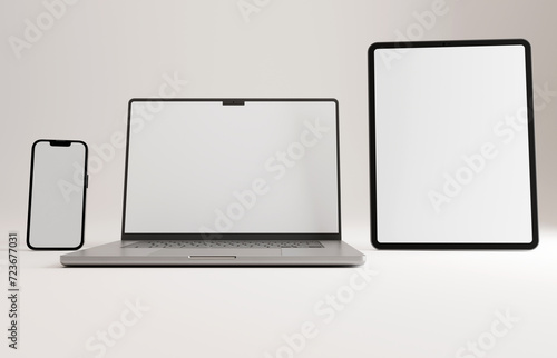 High end phone, tablet and laptop (silver) on white studio backdrop. Blank mockup template screen.