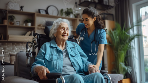 Caregiver happily assisting an elderly person in their own home photo