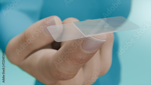 Close-Up of a Hand Holding a Skin Patch with Micro-Needles. Transdermal Vaccination: A Novel Method Using a Skin Patch with Micro-Needles, 3D rendering.