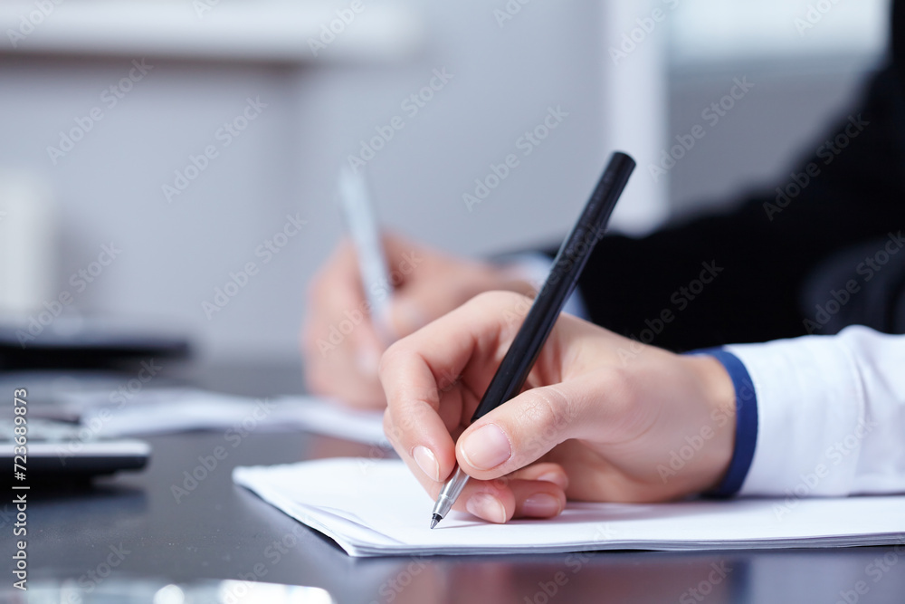 Two business people sitting at office top view close-up making deal on contract Two business people sitting at office top view close-up making deal on contract