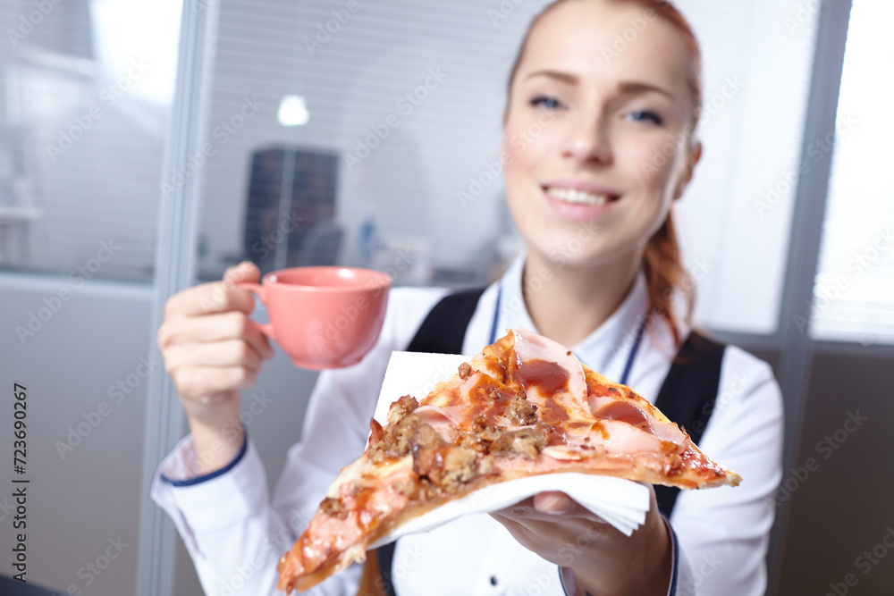 businesswomen with pizza in office businesswomen with pizza in office