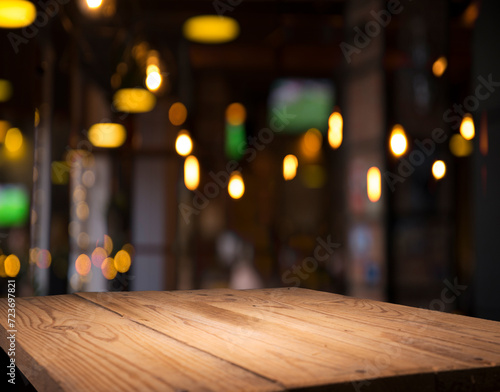 empty table to showcase your product  against the background of a blurred cafe golden bokeh. High quality photo