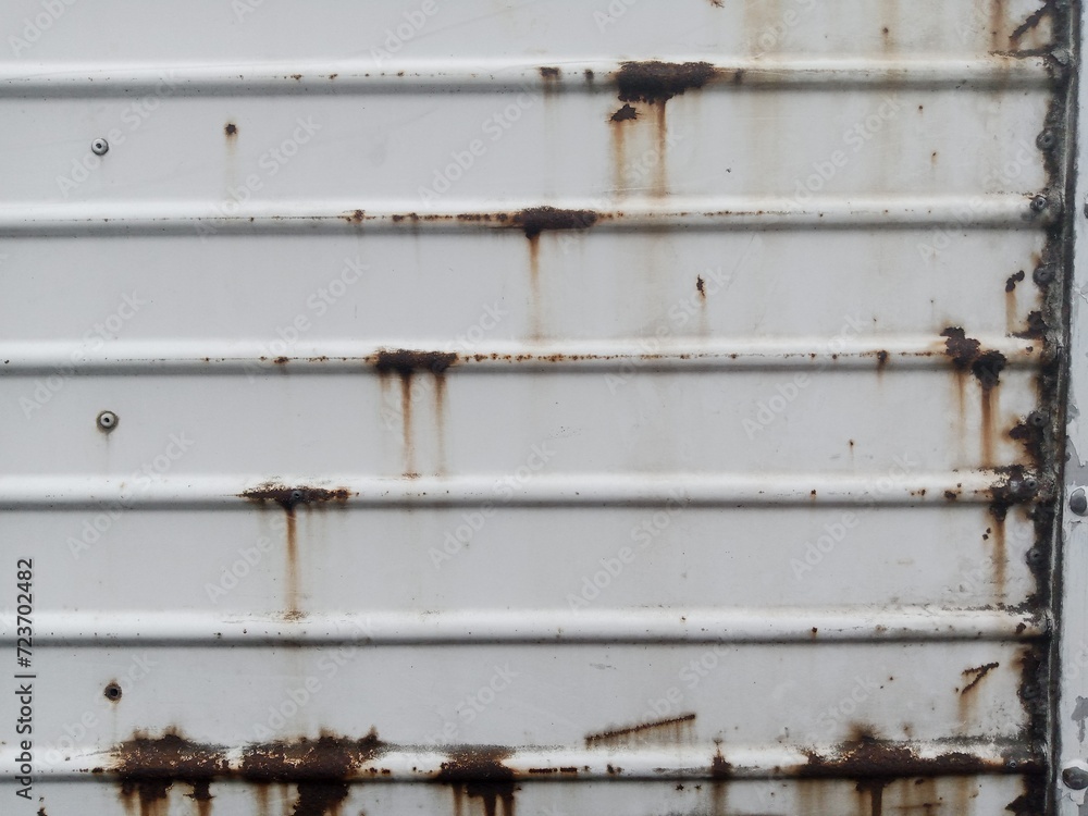 Rusty white metal door. rusty iron texture. Suitable for rusty background themes Rusty white metal door. rusty iron texture. Suitable for rusty background themes