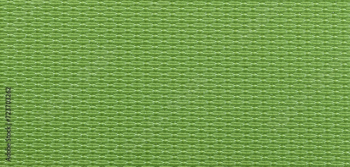 Background made of a closeup of a green fabric texture