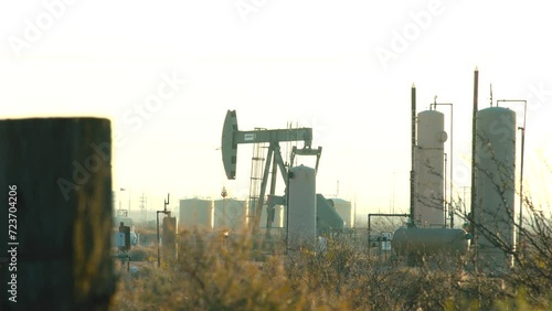 Oil well pumping in Pecos Texas. Permian Basin oil production. January 2024. photo