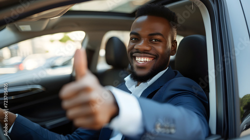 African American black businessman in suit driving new car, smiling happy and showing thumb up, business entrepreneur success concept © BeautyStock