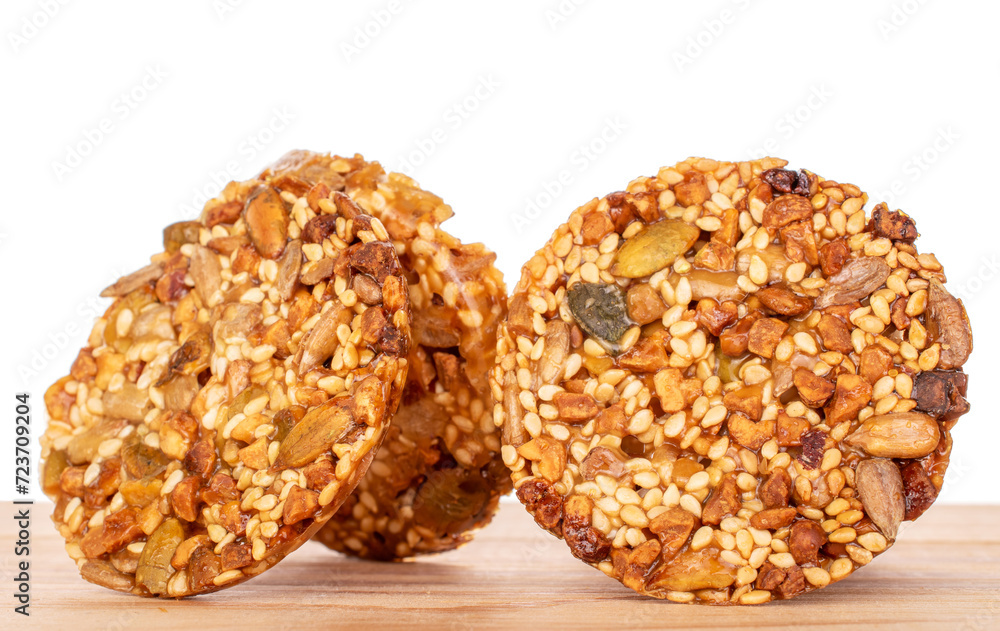 Several sweet thaler cookies on a wooden table, macro, isolated on white background. Several sweet thaler cookies on a wooden table, macro, isolated on white background.