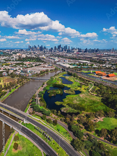 An Aerial view as Maribyrnong River leads to the Melbourne City Skyline on a Sunny summers day.