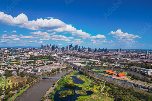 An Aerial view as Maribyrnong River leads to the Melbourne City Skyline on a Sunny summers day. photo