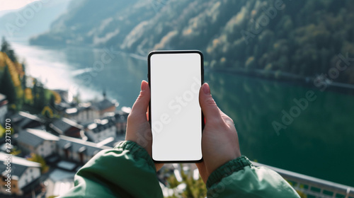 Human playing cellphone with Empty screen for advertising. photo