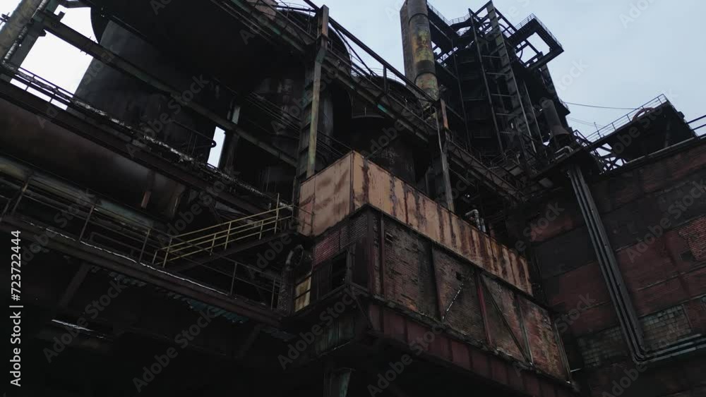 Low angle view of the abandoned structure of the former blast furnace buildings. Slow panning camera movement Low angle view of the abandoned structure of the former blast furnace buildings. Slow panning camera movement