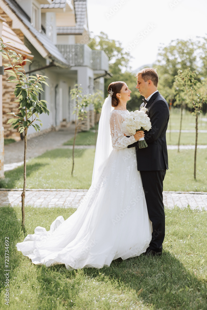 Happy couple celebrating their wedding outdoors. Amazing smiling wedding couple. Pretty bride and stylish groom. Wedding portrait. Happy couple celebrating their wedding outdoors. Amazing smiling wedding couple. Pretty bride and stylish groom. Wedding portrait.
