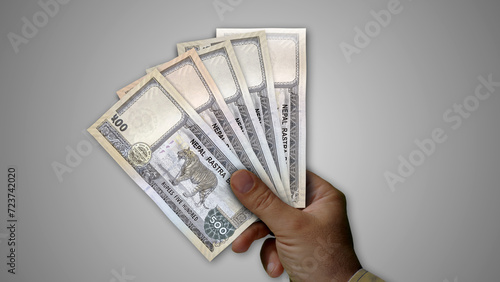 Nepal rupee growing pile of money in hand concept 3d illustration