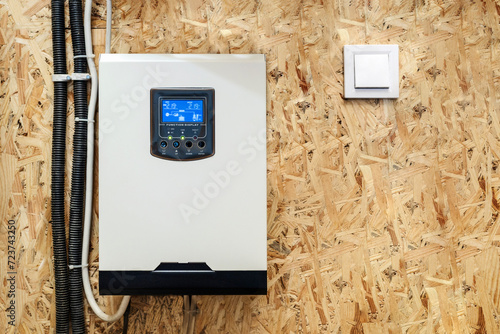 Solar Inverter Hybrid isometric System Controller with Switch. Home Battery Energy Storage located in Garage Wall.