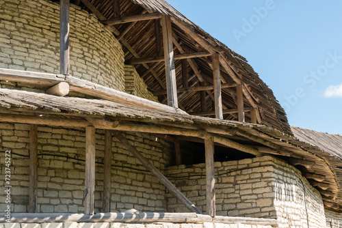 Pskov, Russia, September 6, 2023. Fragment of the wall of an old fortress with a wooden gallery.