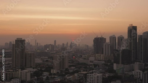 Wallpaper Mural The sun sets amidst the density of buildings and the hustle and bustle of Bangkok city Torontodigital.ca