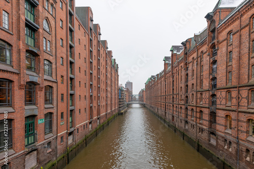 Germany's second largest city Hamburg streets canals and symbolic buildings snow and colorful cloudy sky and daylight in winter © Aytug Bayer