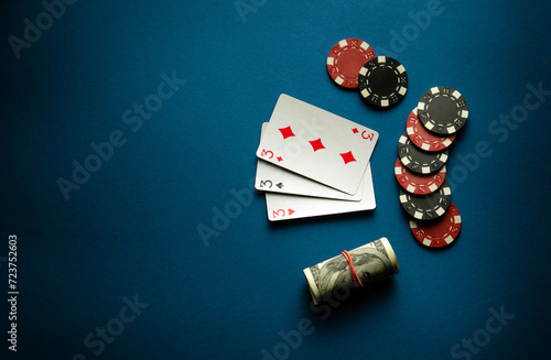 Playing cards with a winning combination of three aces. Winning a game of poker depends on fortune and luck. Advertising space photo