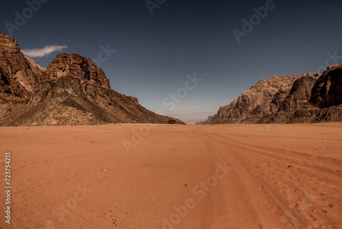 Wadi Rum Desert in Jordan. On the Sunset. Panorama of beautiful sand pattern on the dune. Desert landscape in Jordan. Travel concept. Freedom