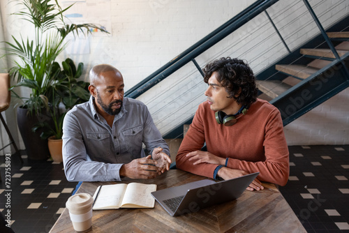 Mature businessman mentoring young entrepreneur