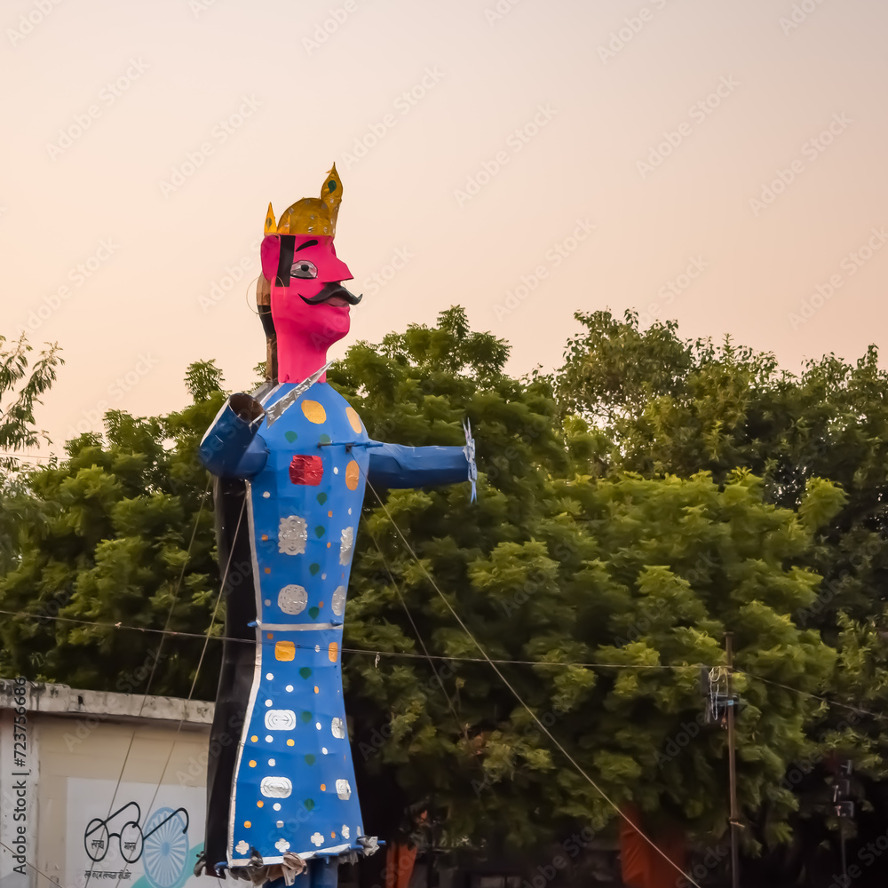 Fototapeta premium Ravnans being ignited during Dussera festival at ramleela ground in Delhi, India, Big statue of Ravana to get fire during the Fair of Dussera to celebrate the victory of truth by Lord Rama