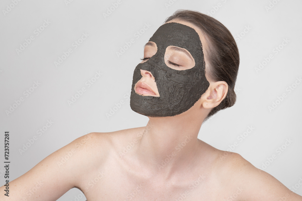 Portrait of a beautiful girl wearing a clay mask Portrait of a beautiful girl wearing a clay mask