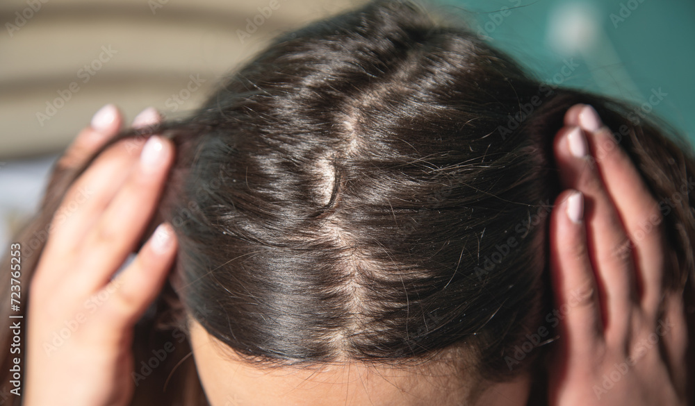 Fototapeta premium Caucasian woman showing her hair.