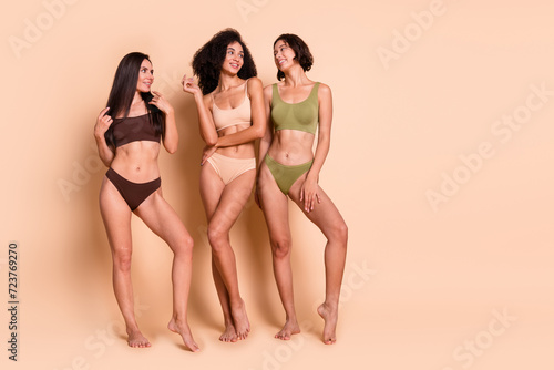 No filter studio photo of shiny adorable women wear lingerie loving themselves empty space isolated pastel color background