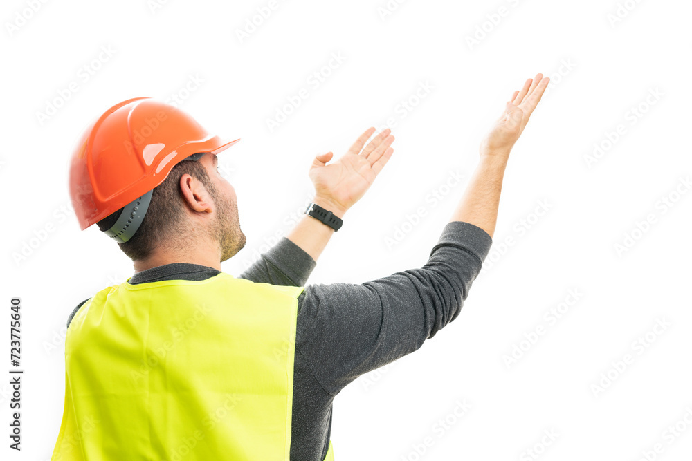 Model as builder man pointing palms at blank copyspace Model as builder man pointing palms at blank copyspace