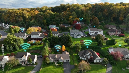 High speed wifi internet connection with Wi-Fi symbols over residential homes in american suburban neighborhood. Graphic. Aerial shot photo
